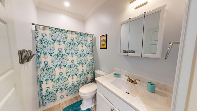 bathroom with hardwood / wood-style flooring, a shower with curtain, ornamental molding, vanity, and toilet