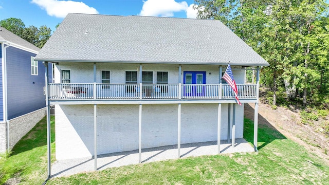 back of house with a yard