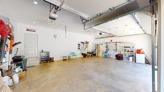 85 Breeze Pt, Savannah, TN 38372 - garage with a garage door opener, a ceiling fan, recessed lighting, and a workshop area