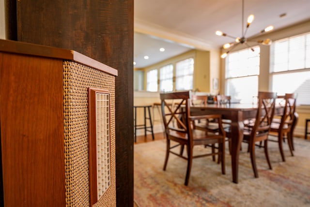 dining room featuring carpet floors and an inviting chandelier