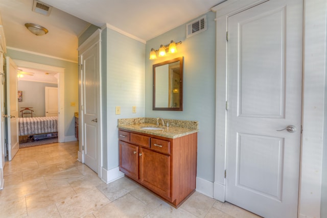 bathroom with vanity and crown molding