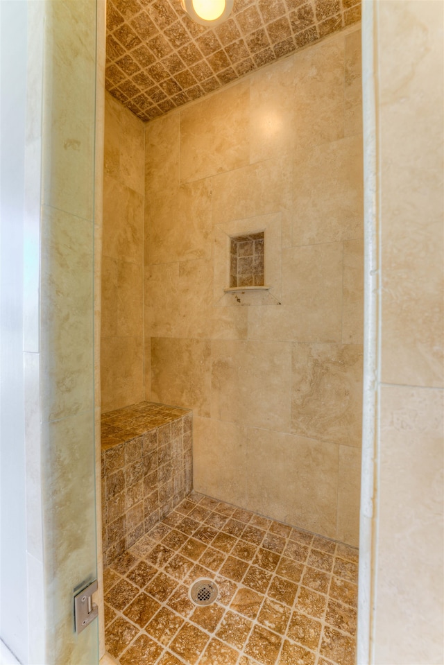 bathroom with a tile shower