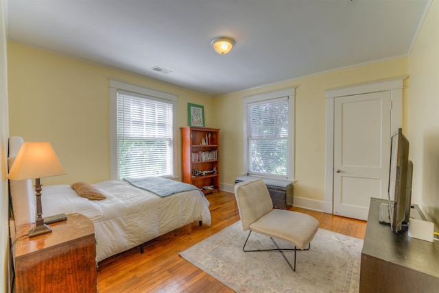 bedroom with light hardwood / wood-style floors