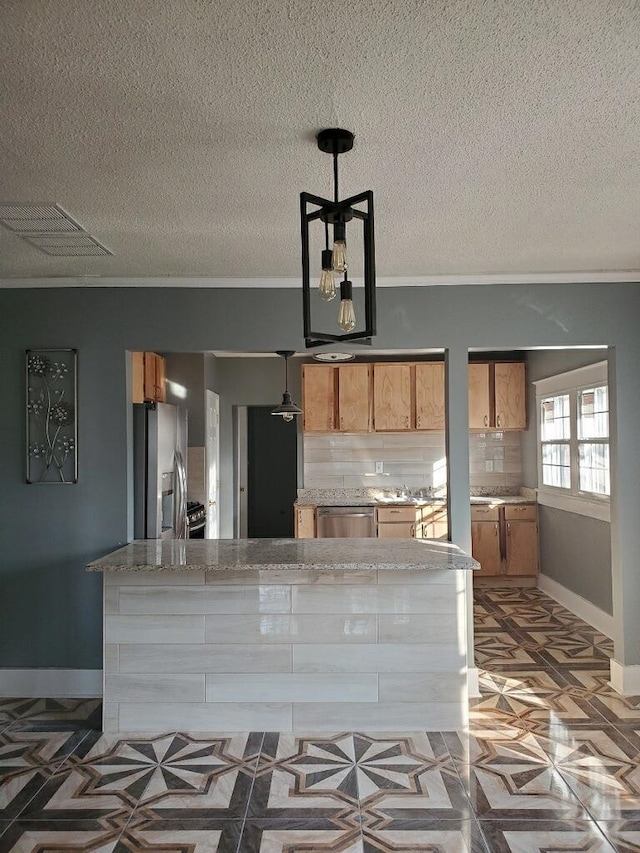 kitchen with hanging light fixtures, a textured ceiling, stainless steel appliances, dark parquet flooring, and decorative backsplash