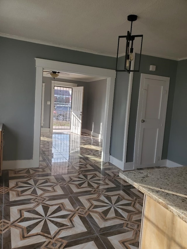 interior space featuring a textured ceiling, crown molding, and ceiling fan with notable chandelier