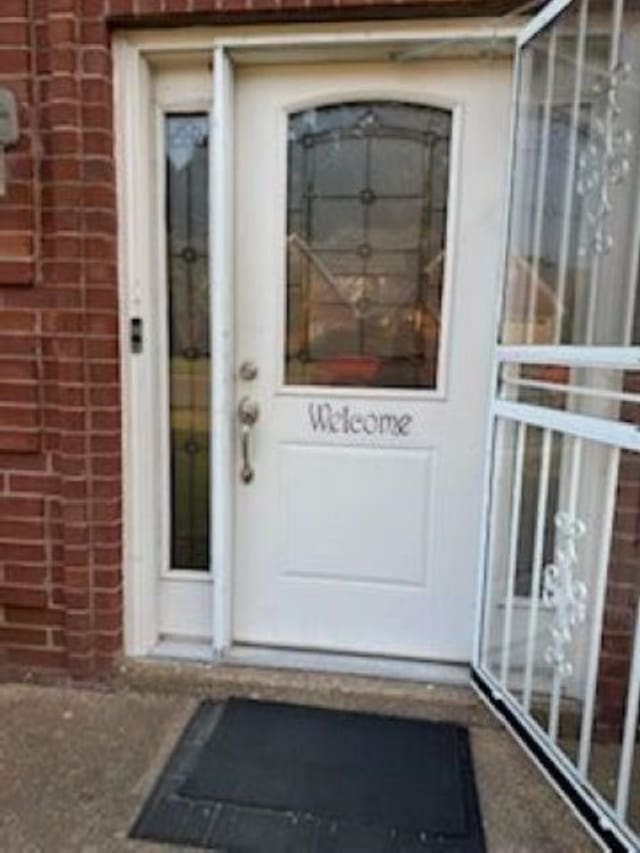 7565 Wintergreen Ln NW, Tn, TN 38018 - doorway to property featuring brick siding