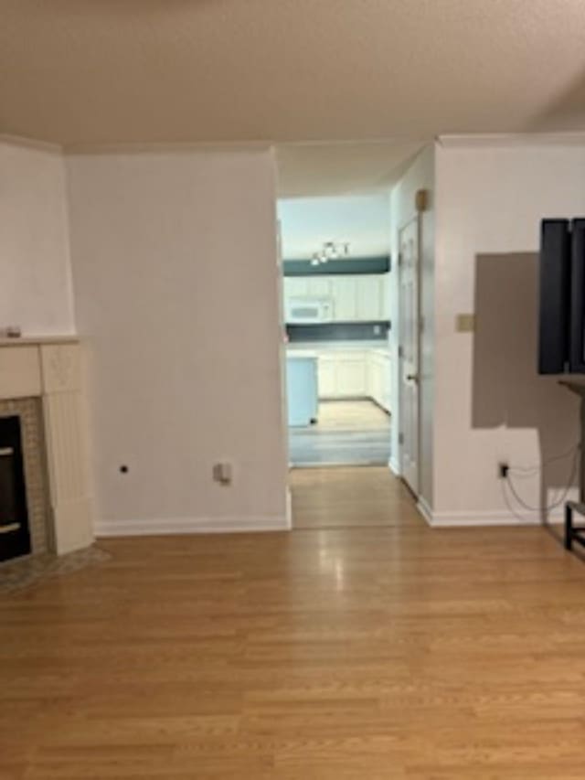 unfurnished living room featuring light hardwood / wood-style floors