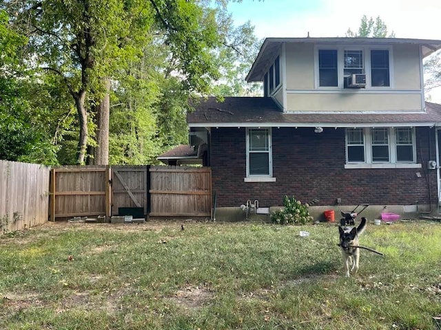 view of side of home featuring a lawn