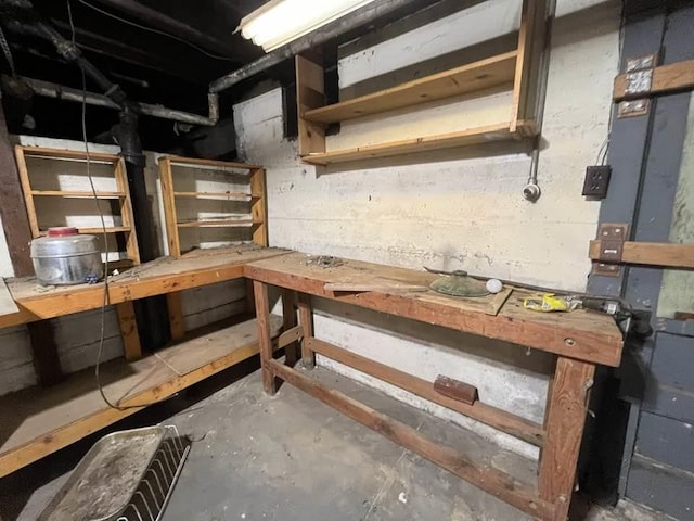 basement with a workshop area