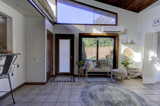 tiled entryway with wooden ceiling, a wall mounted air conditioner, and high vaulted ceiling