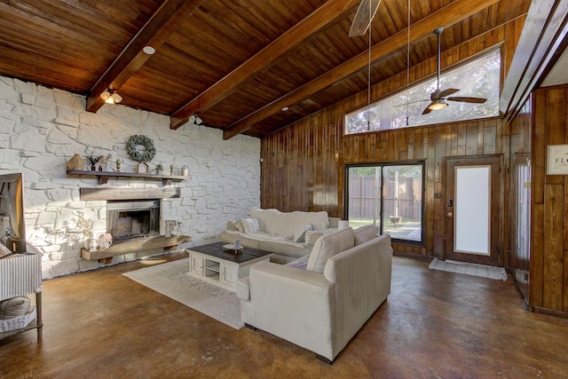 living room featuring high vaulted ceiling, wood walls, ceiling fan, and a fireplace