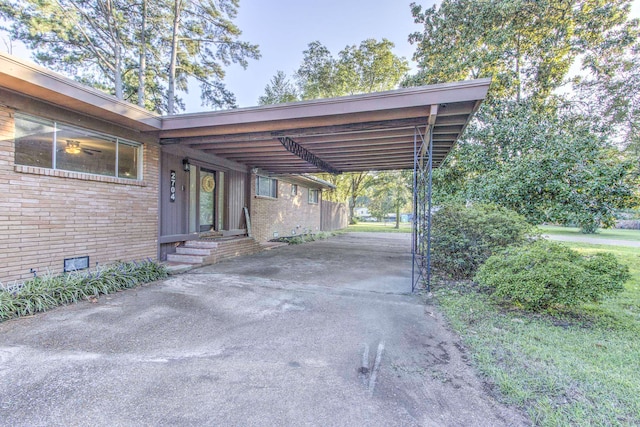 view of vehicle parking with a carport