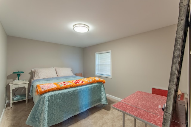 bedroom featuring baseboards and carpet flooring