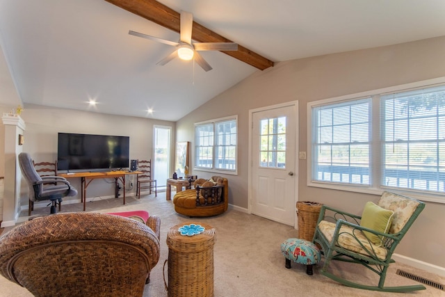 carpeted living room featuring ceiling fan and vaulted ceiling with beams