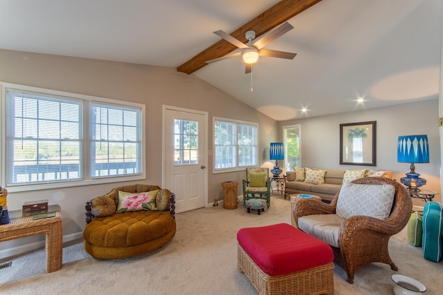 carpeted living room featuring ceiling fan, baseboards, and lofted ceiling with beams
