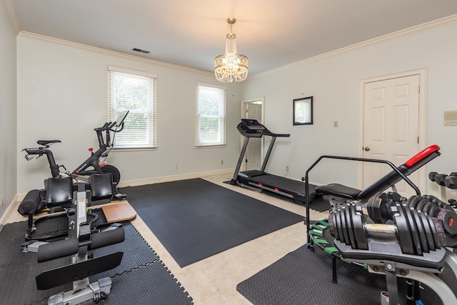 workout area featuring an inviting chandelier, carpet, and crown molding