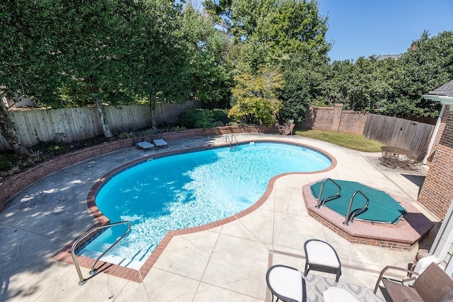 view of pool featuring a patio area