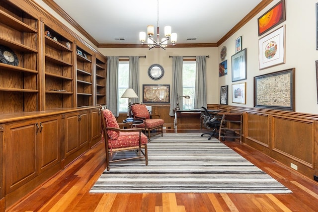 office with a notable chandelier, ornamental molding, and dark wood-type flooring