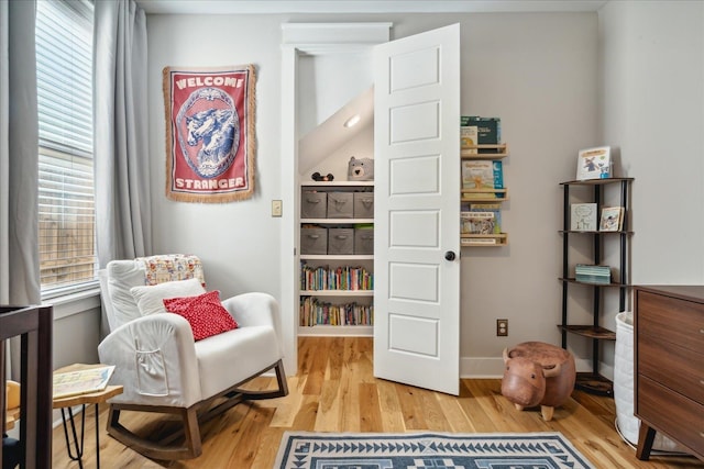 sitting room featuring hardwood / wood-style flooring