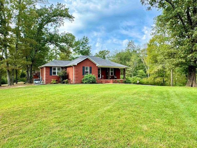 ranch-style home featuring a front yard