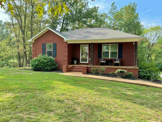 single story home with a front yard and a porch