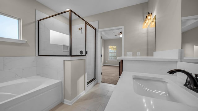 bathroom with ceiling fan, a healthy amount of sunlight, vanity, and independent shower and bath