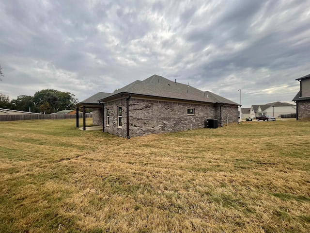 view of property exterior with a yard