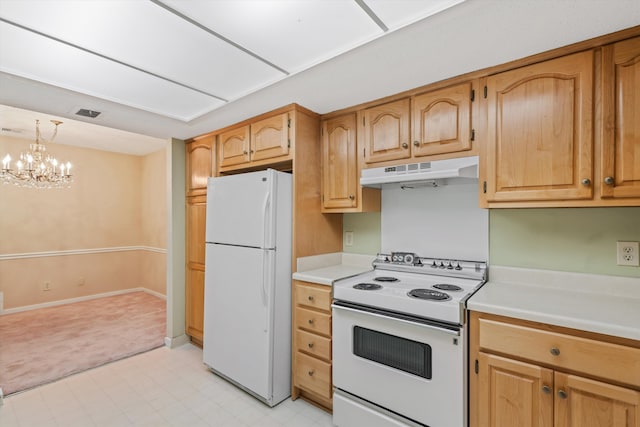 kitchen featuring a notable chandelier, white appliances, and decorative light fixtures