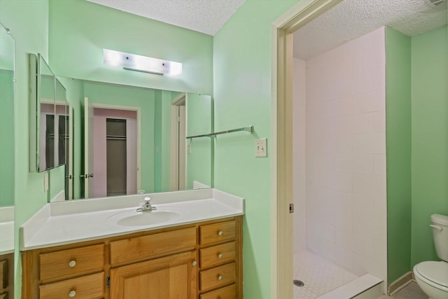 4781 Audubon View Cir Unit 2, Memphis, TN 38117 - bathroom featuring vanity, a textured ceiling, and a stall shower