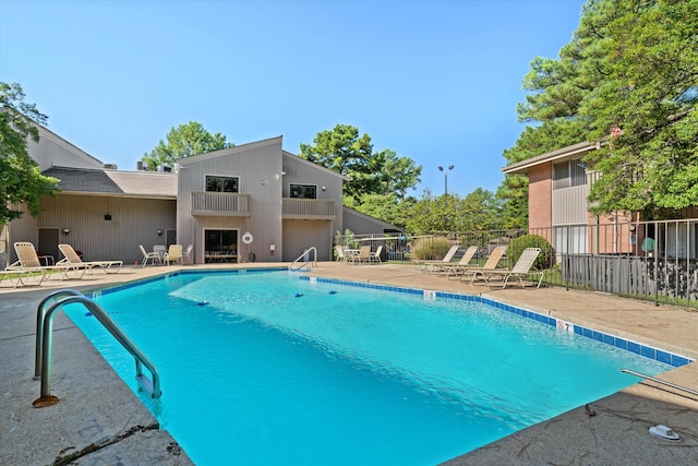 view of swimming pool featuring a patio area