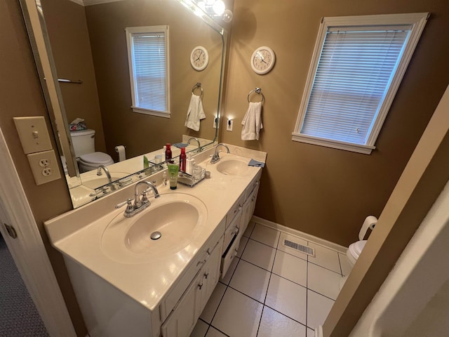 bathroom featuring vanity, toilet, and tile patterned floors