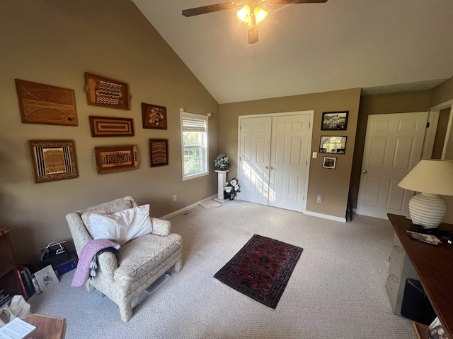 living area featuring high vaulted ceiling, carpet flooring, and ceiling fan