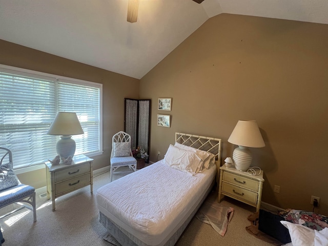 carpeted bedroom featuring lofted ceiling and ceiling fan