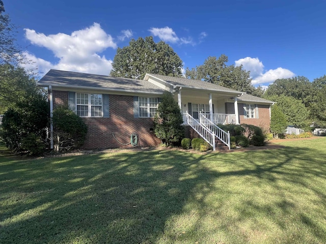 ranch-style home featuring a front yard and a porch