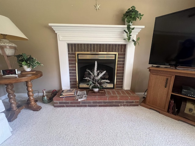 interior details featuring carpet floors and a brick fireplace