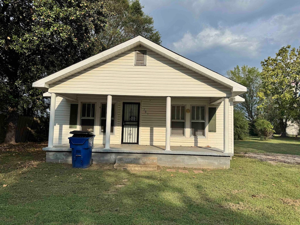 bungalow featuring a front yard and a porch