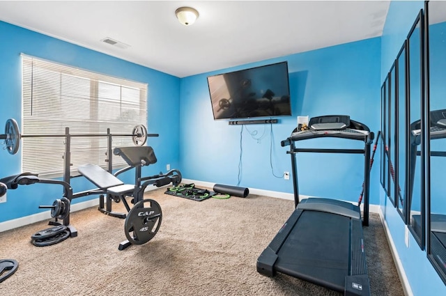 workout area with dark carpet