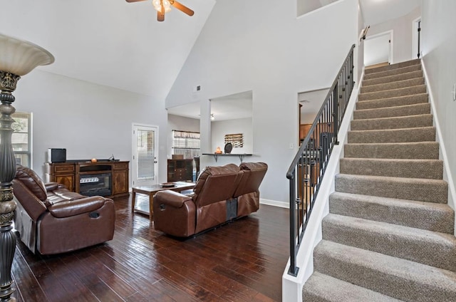 living room with high vaulted ceiling, ceiling fan, and dark hardwood / wood-style flooring