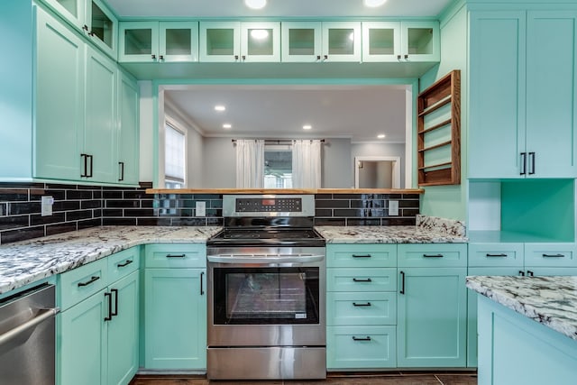 kitchen with stainless steel range with electric cooktop, backsplash, light stone counters, and ornamental molding