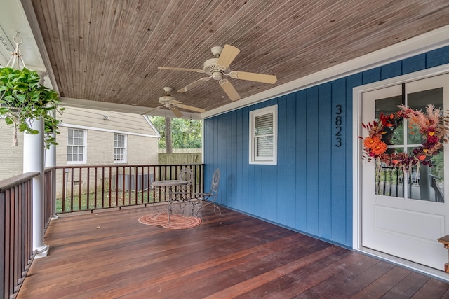 wooden deck featuring ceiling fan