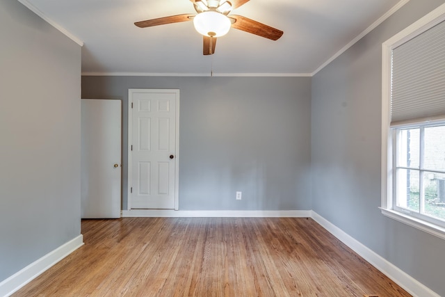 spare room with ceiling fan, light hardwood / wood-style flooring, and crown molding