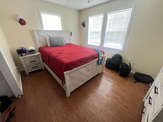 1405 Hurricane Dr, Sardis, TN 38371 - bedroom featuring baseboards, dark wood-style floors, and multiple windows