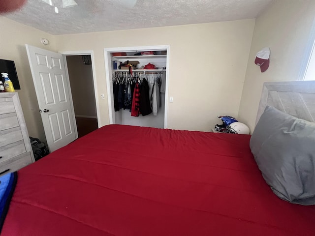 1405 Hurricane Dr, Sardis, TN 38371 - bedroom with a closet, a ceiling fan, and a textured ceiling