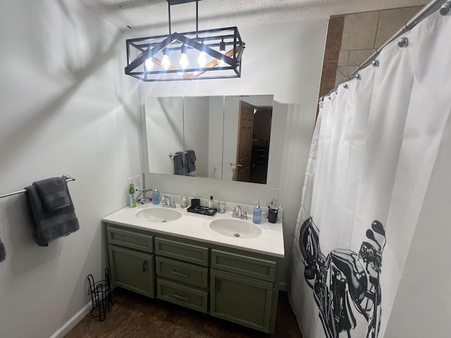 1405 Hurricane Dr, Sardis, TN 38371 - full bathroom featuring a shower with shower curtain, double vanity, a textured ceiling, and a sink