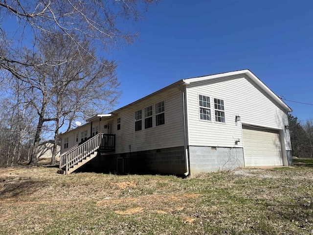1405 Hurricane Dr, Sardis, TN 38371 - view of side of home featuring a garage and crawl space