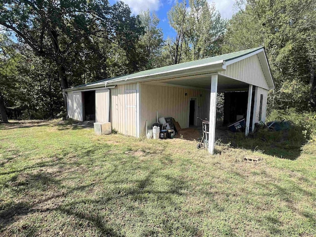 1405 Hurricane Dr, Sardis, TN 38371 - view of pole building with a yard