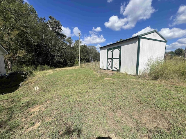 1405 Hurricane Dr, Sardis, TN 38371 - view of yard featuring an outbuilding and a storage unit