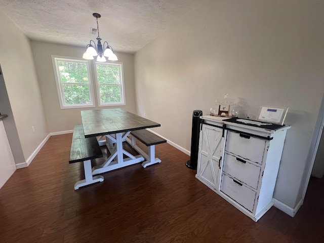 1405 Hurricane Dr, Sardis, TN 38371 - dining area featuring an inviting chandelier, baseboards, dark wood finished floors, and a textured ceiling