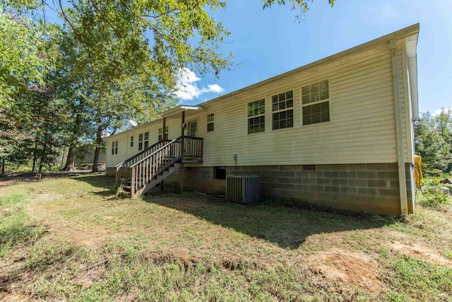 back of property with central air condition unit