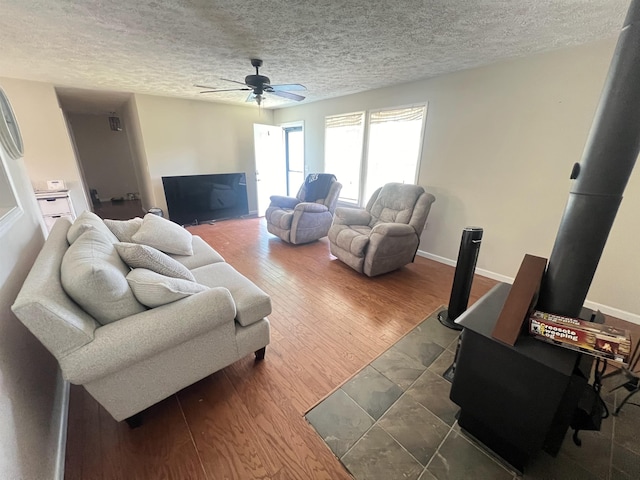 1405 Hurricane Dr, Sardis, TN 38371 - living room with baseboards, a ceiling fan, a textured ceiling, and wood finished floors